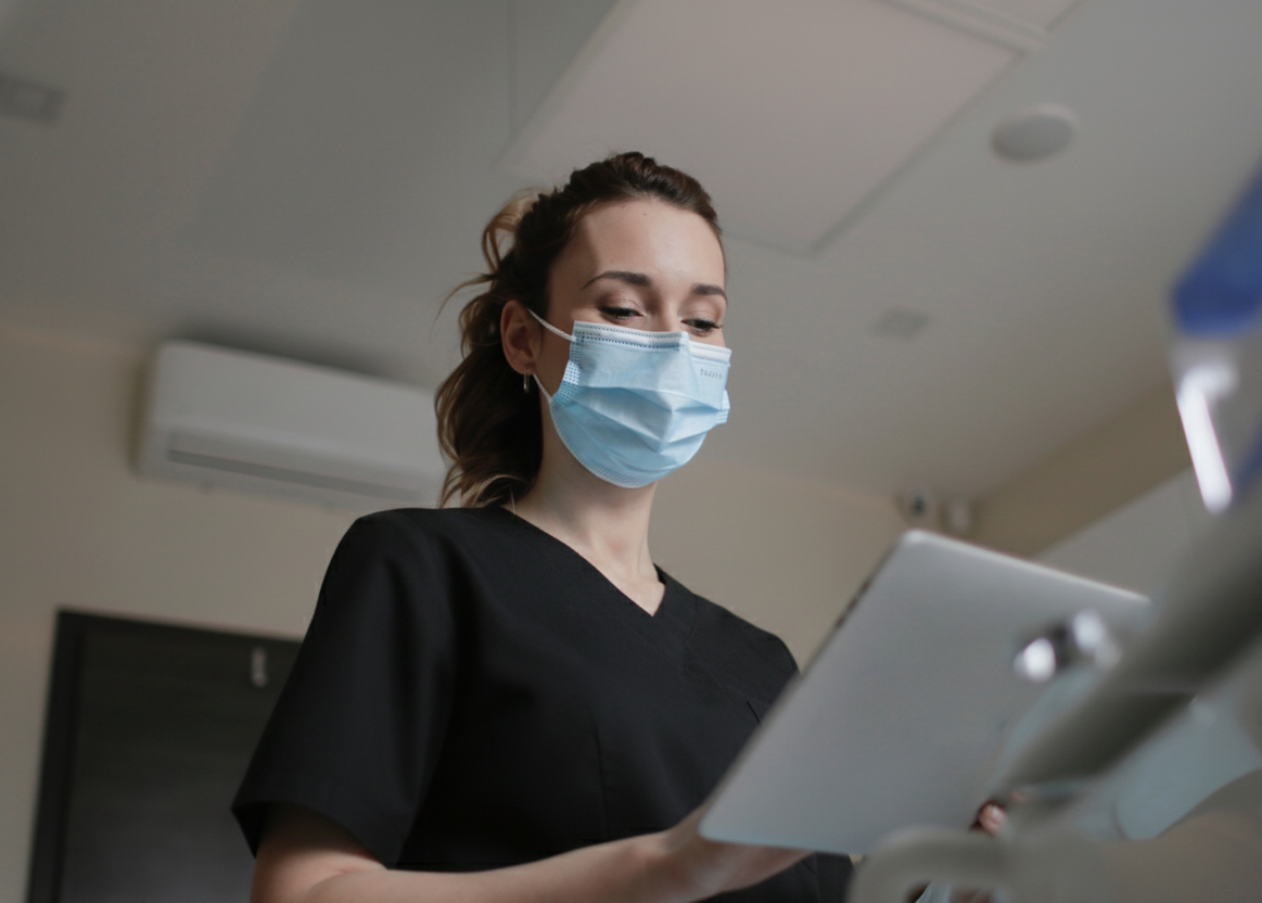Omicron Clinical Nurse drawing blood at home